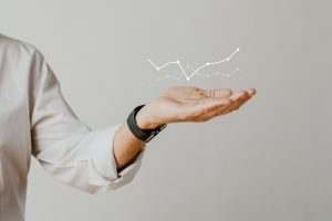 digital-graph-with-businessman-hand-overlay